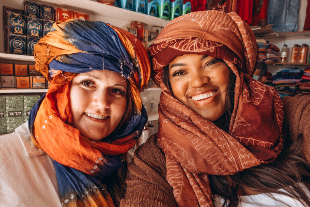 trying on headscarfs