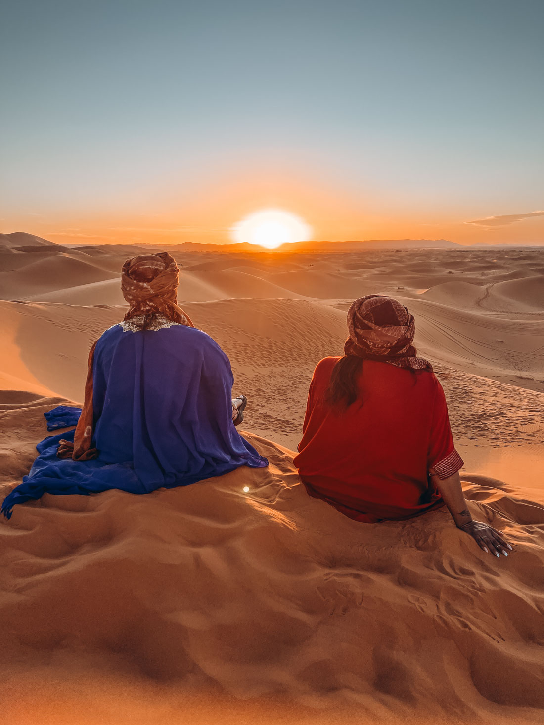 watching the sunset in erg chebbi - Marrakech to Fes Desert Tour